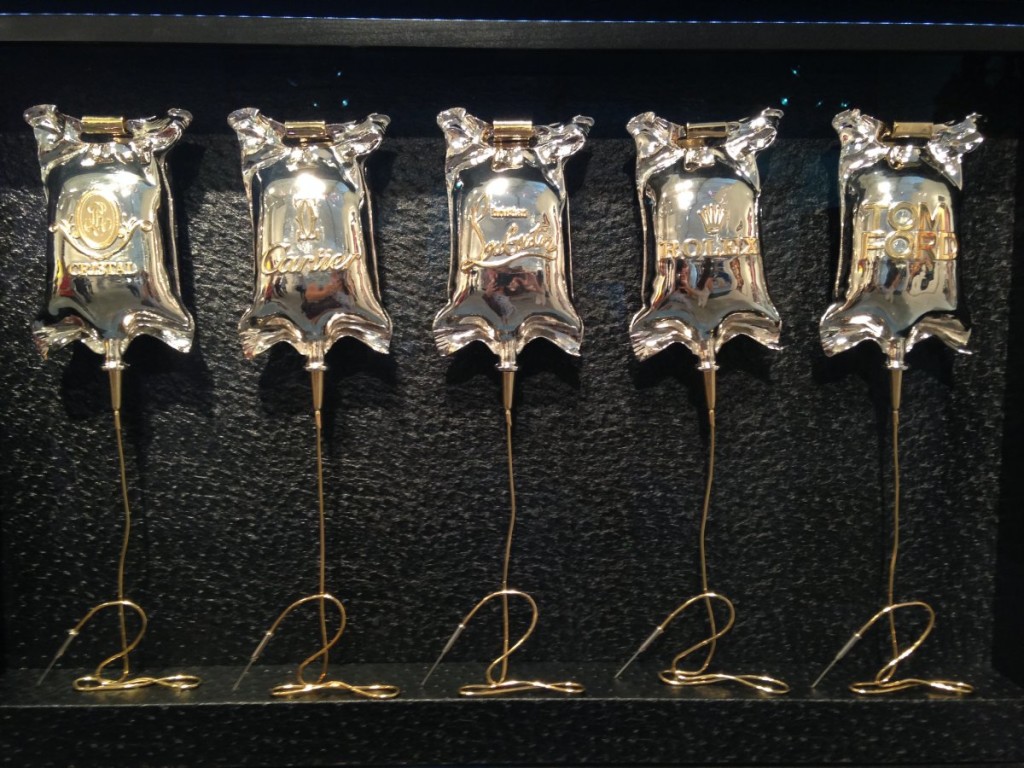 the-same-artist-created-these-intensive-care-units-made-of-18k-and-nickel-plated-metal-encased-in-plexiglass-look-closely-to-see-the-designer-names